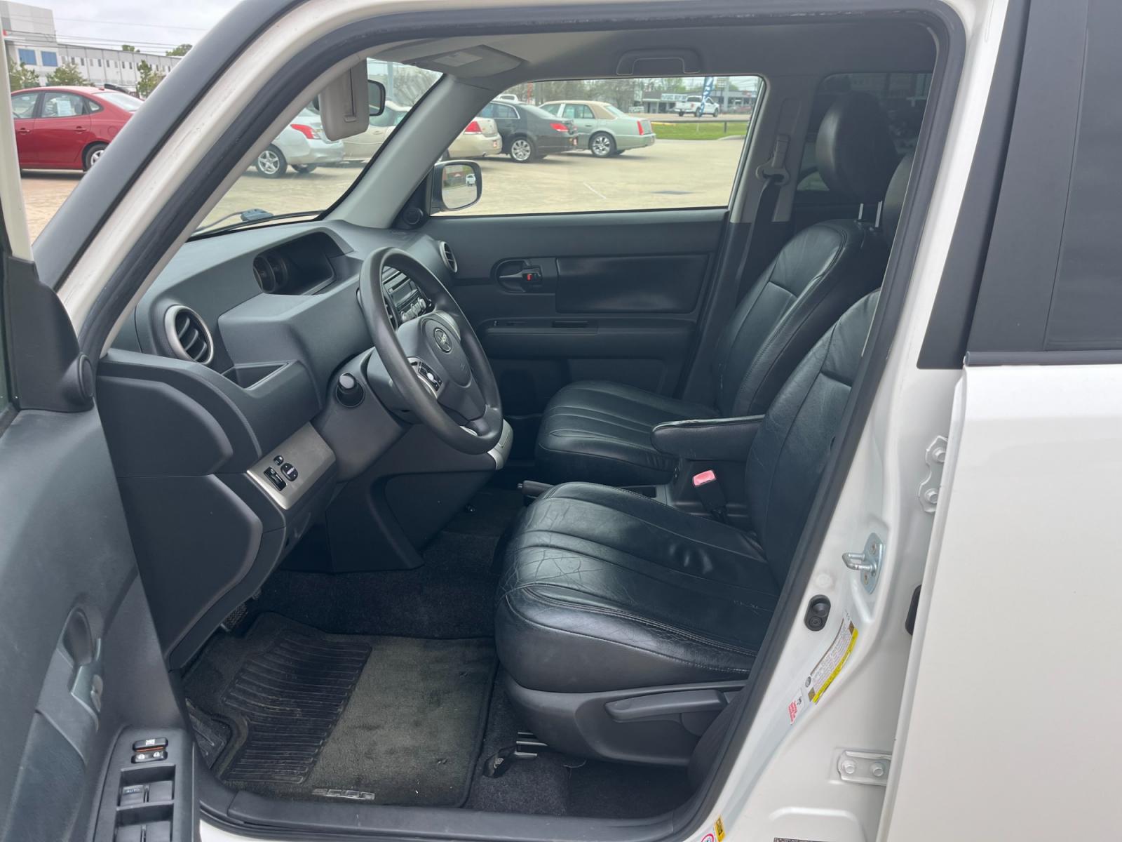 2009 white /black Scion xB Wagon (JTLKE50E591) with an 2.4L L4 DOHC 16V engine, Automatic transmission, located at 14700 Tomball Parkway 249, Houston, TX, 77086, (281) 444-2200, 29.928619, -95.504074 - Photo #8